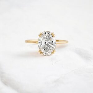 oval-cut-moissanite-solitaire-ring-with-double-button-prongs-sarlyn-1