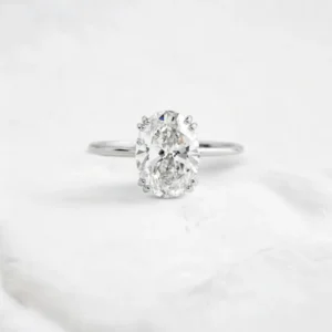 oval-cut-moissanite-solitaire-ring-with-double-button-prongs-sarlyn-4