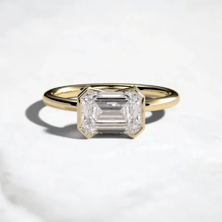 2ct-emerald-cut-diamond-half-bezel-engagement-ring-1